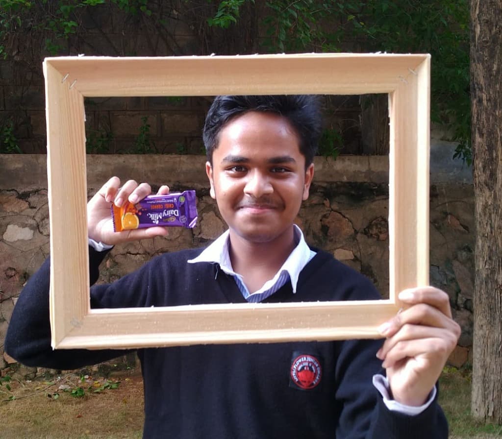 Student recognition and creative photo-framing activity during Lit Club literary celebrations